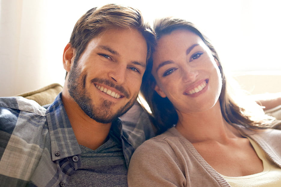 Man and Woman Smiling After Botox Treatment Plan at Kalos Medical Spa in Fort Worth