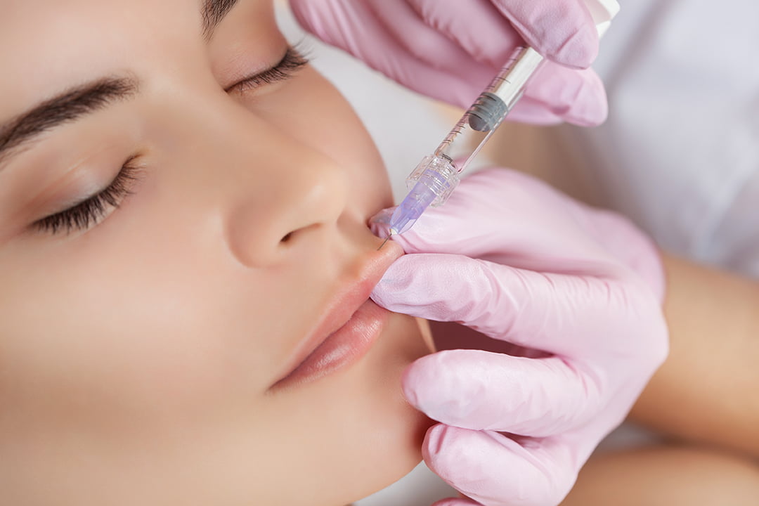 woman receiving lip injections