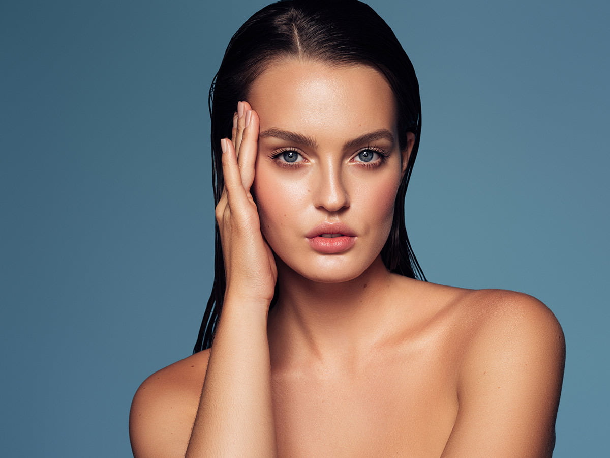 CO2 Laser Skin Resurfacing Gives Woman With Beautiful Skin Blue Background