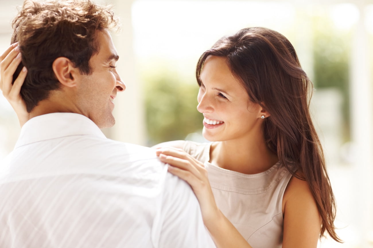 Man and Woman Smiling After Hair Restoration Treatment Plan at Kalos Medical Spa in Fort Worth