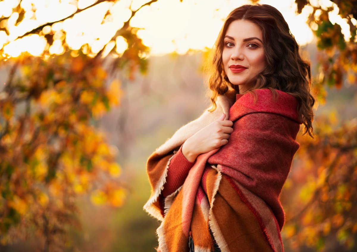 Beautiful Young Woman in the Autumn Leaves in the Fall in Fort Worth