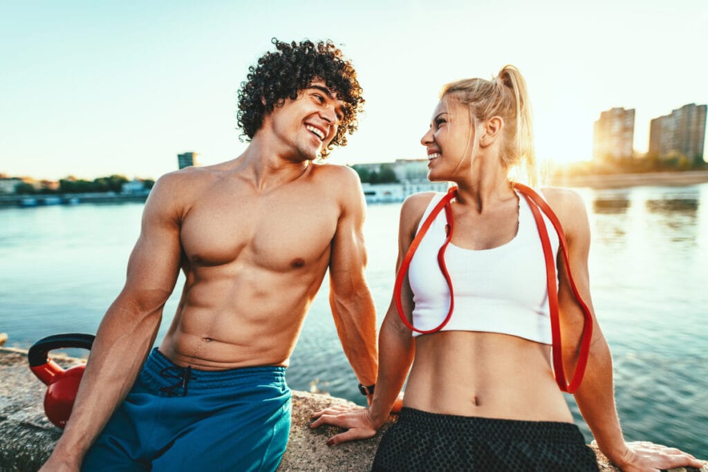 Smiling young couple after workout